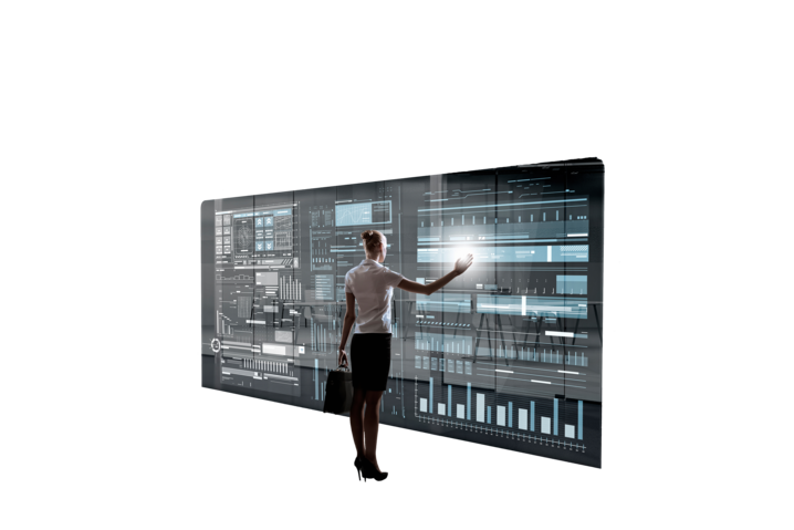Photo of a person tapping on a large screen displaying various statistics