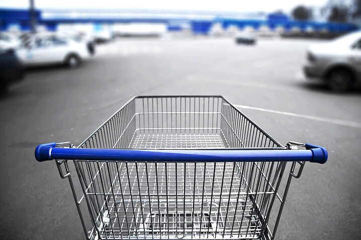 Photo of a shopping cart in a parking lot