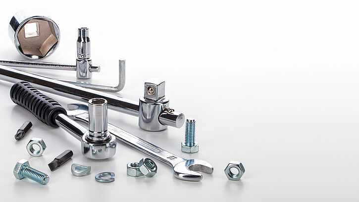 Image shows metal tools and small components