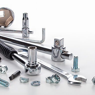 Image shows metal tools and small components